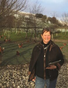 Anne Fleck with poultry & iPad